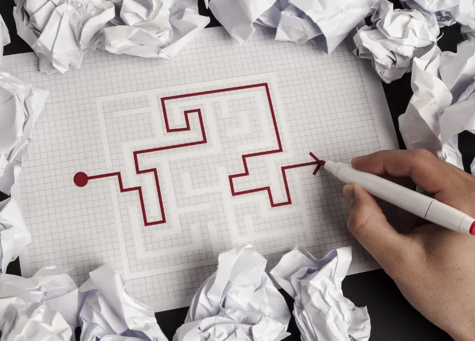 Man solving escape room answers on paper