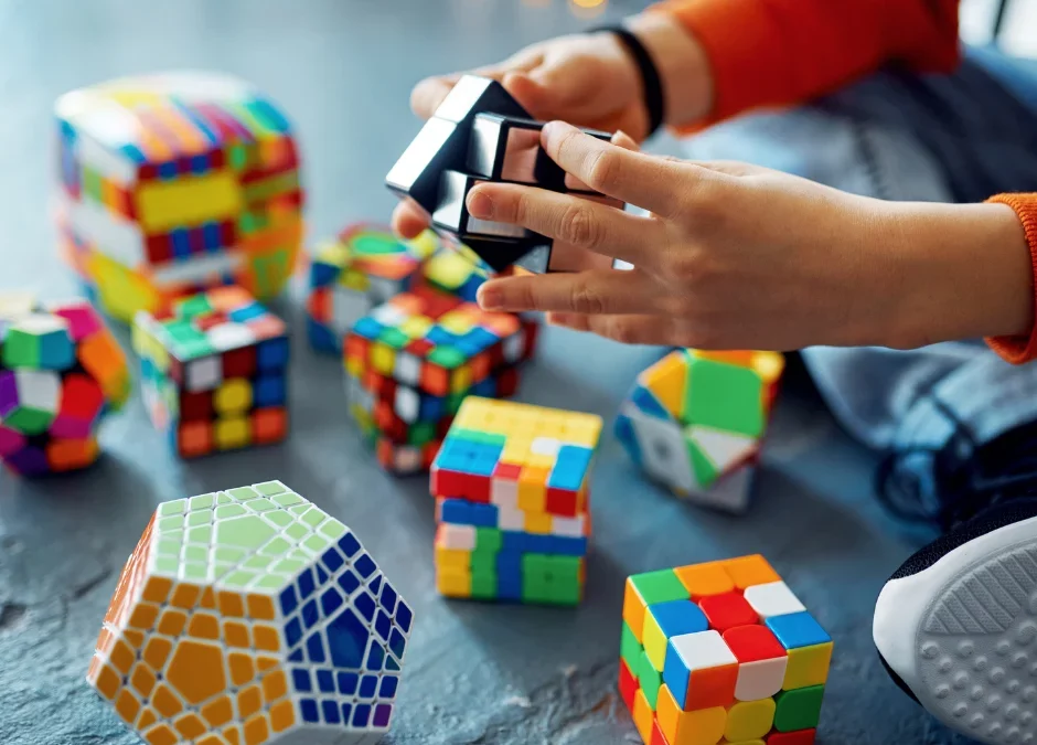 A child solving an escape room puzzle box
