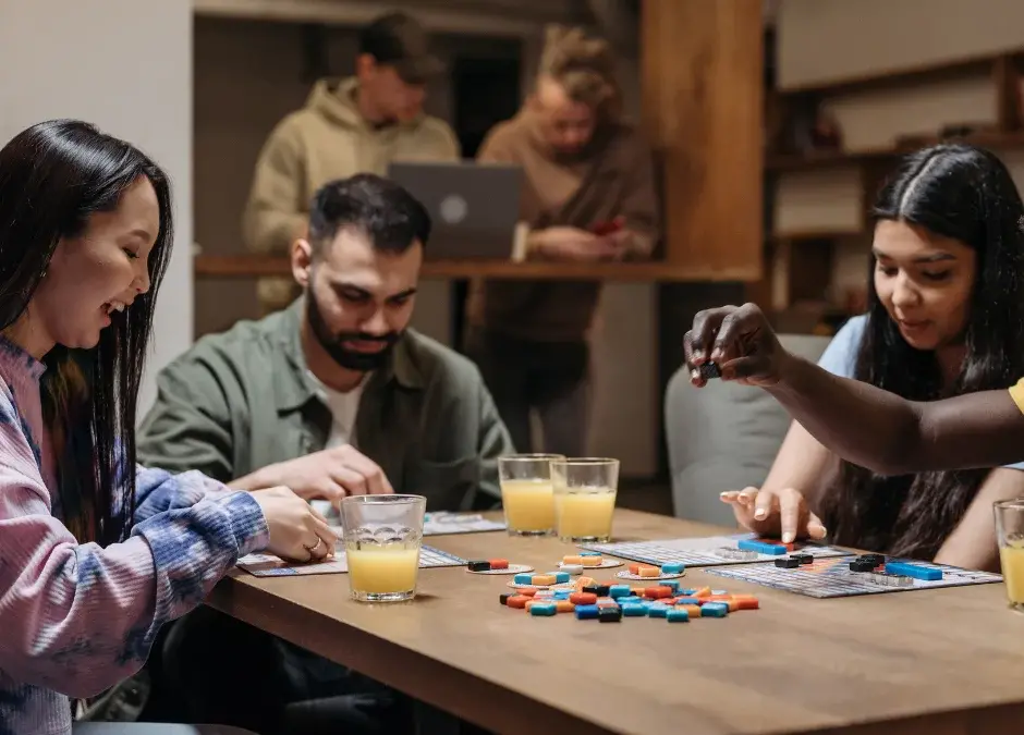 A group of people playing communication games in the workplace